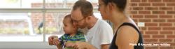 Parents singing with child