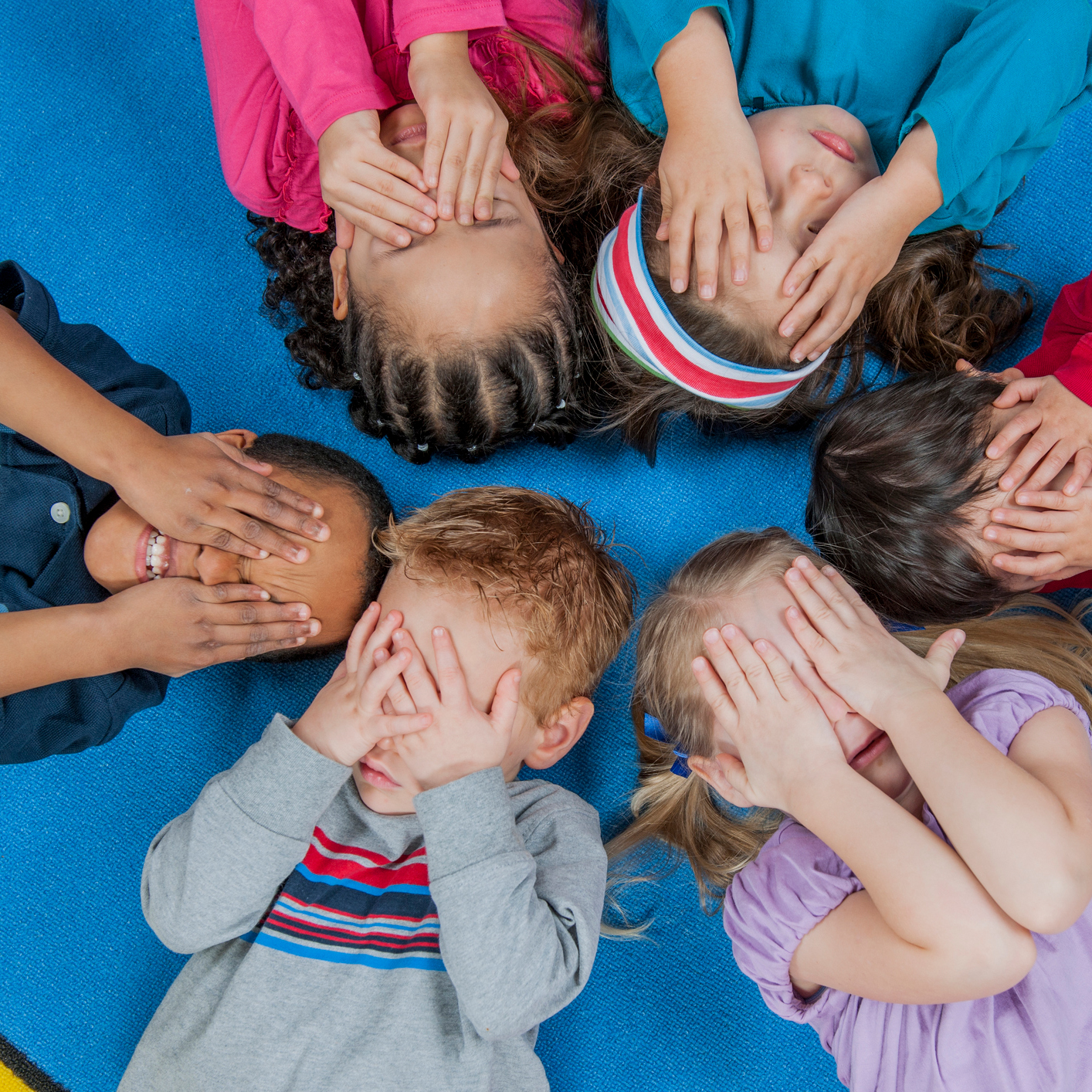 Learn about NAEYC's technical assistance work. Six diverse young children covering their eyes.